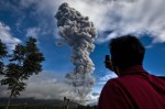 Indonesia raises alert as volcano erupts hot gas